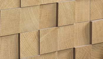 Carrelage en relief texturé jouant avec la lumière pour créer un effet architectural en façade intérieure