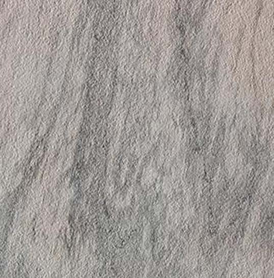 Texture de carrelage de façade en grès cérame clair utilisé sur l’Opéra de Florence, finition minérale et mate